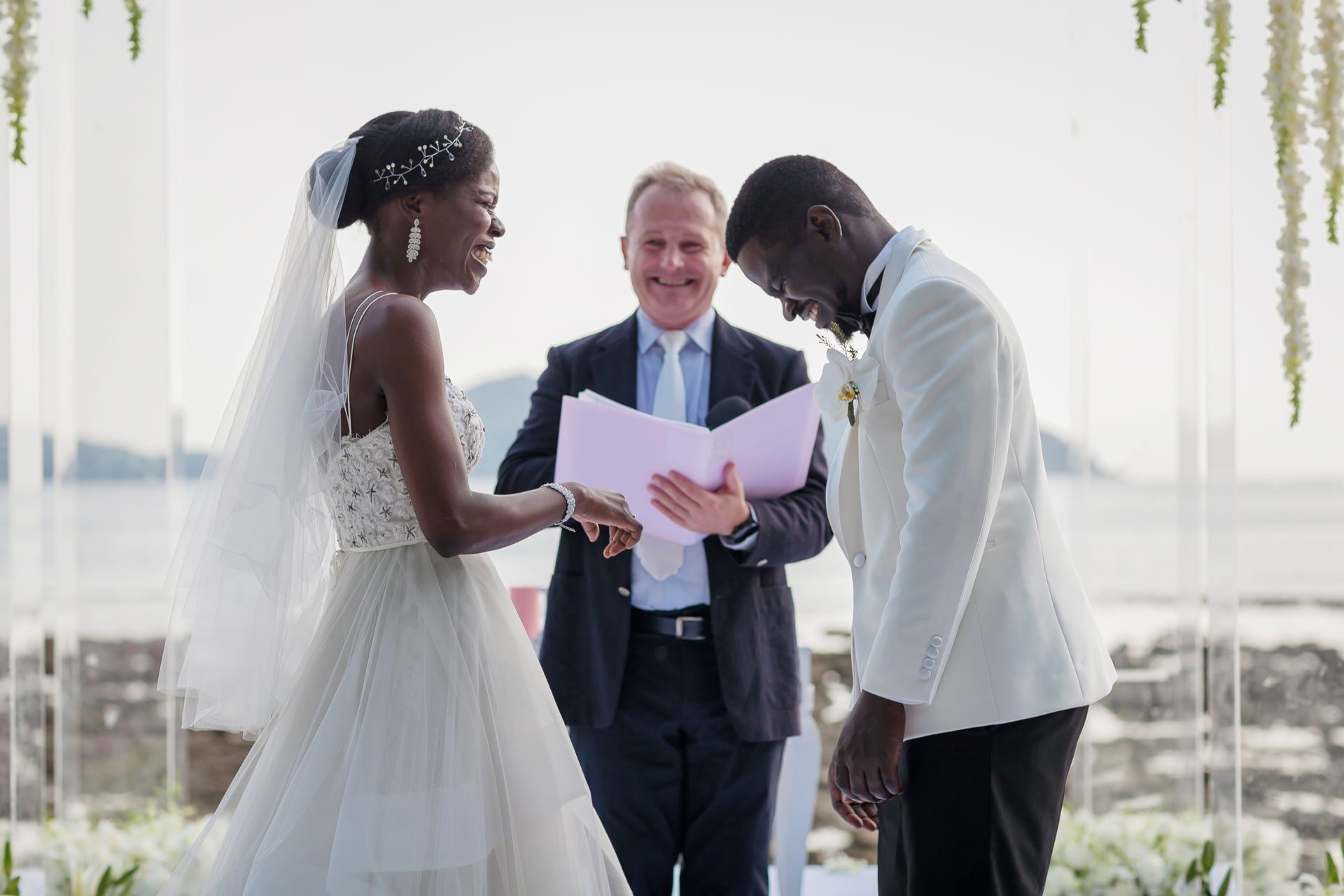 Paul Cunliffe — Wedding Celebrant Asia, Phuket Paul Cunliffe, English-speaking wedding celebrant in Phuket, smiling as he officiates a beachfront ceremony at Thavorn Beach Village